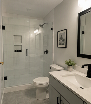 Bathroom remodel — walk-in glass shower, gray vanity, framed art